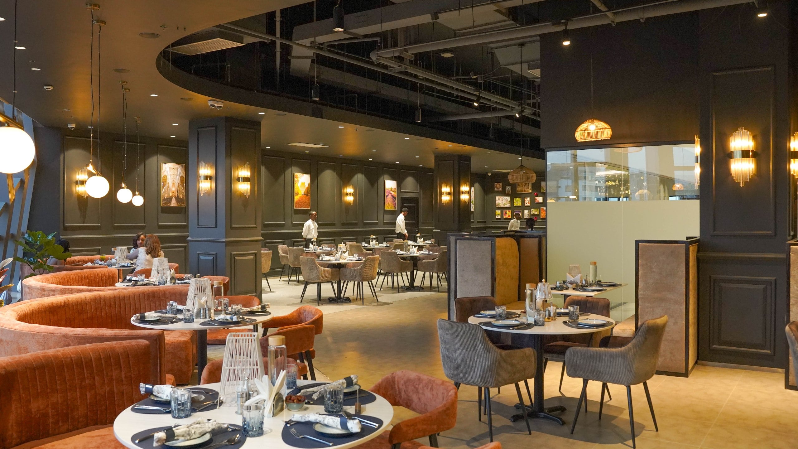 Rue Addis dining room — city-vintage booths and set tables